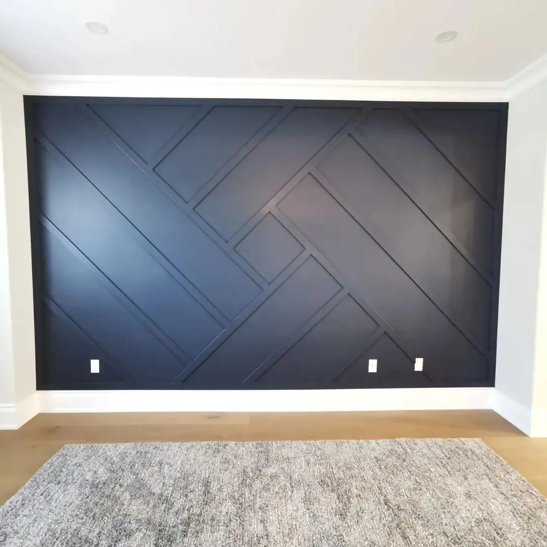 A room with a black wall and white trim.