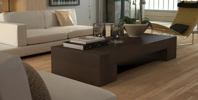 A coffee table with books and vases on top of it.